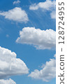 Blue sky and rhythmically arranged clouds: vertical composition 128724955