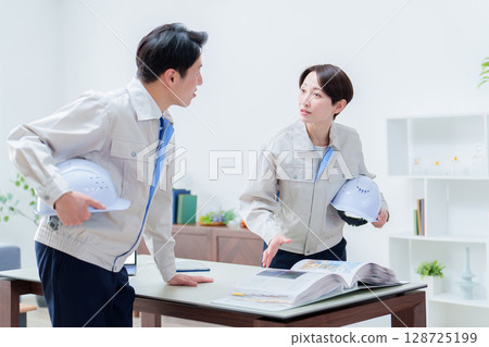 Workers having a meeting in the office Workers having a meeting in the office 128725199