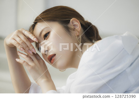 A woman lying on the floor 128725390