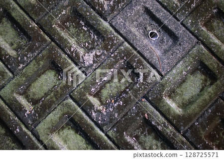Dirty and aged concrete block wall Dirty and aged concrete block wall 128725571