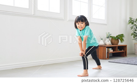 Girl exercising in the room Girl exercising in the room 128725646