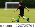 Children practicing soccer 128725704