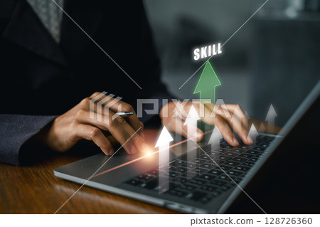 Businessperson enhancing skills on a laptop with growth arrows, symbolizing career advancement and personal development. Businessperson enhancing skills on a laptop with growth arrows, symbolizing career advancement and personal development. 128726360