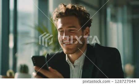 Businessman making a video call in the office 7 128727044