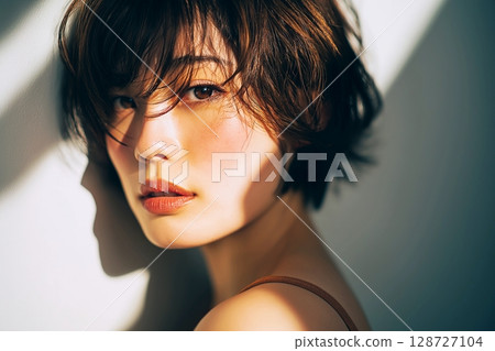 "AI-generated image" of a beautiful woman with a stylish hairstyle 128727104