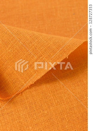 orange hemp viscose natural fabric cloth color, sackcloth rough texture of textile fashion orange hemp viscose natural fabric cloth color, sackcloth rough texture of textile fashion 128727353