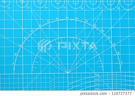 blue cutting mat board background with line and scale measure guide pattern for object art design blue cutting mat board background with line and scale measure guide pattern for object art design 128727377