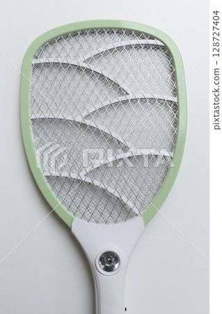 green mosquito swatter isolated on white background 128727404