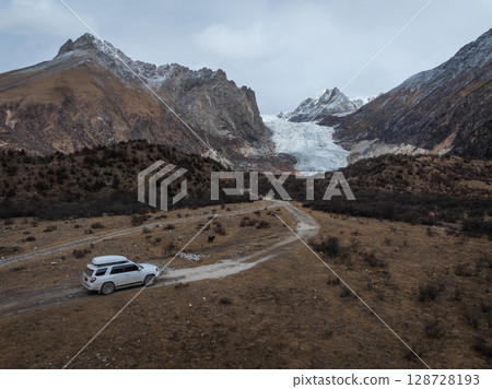 Tibet,China - November 23,2024: Driving off road car in high altitude mountains in tibet, China 128728193
