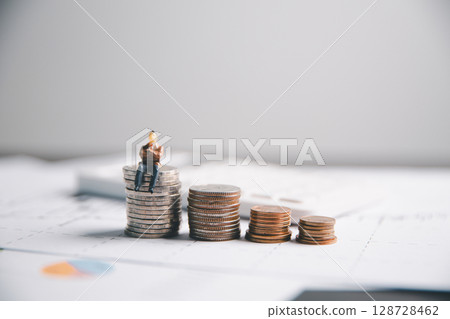 Financial calculate accountant blur background close up on calculator with graph chart banner bank office desk. Finance Concept tax banking money expense accounting budget businessman use calculator. Financial calculate accountant blur background close up on calculator with graph chart banner bank office desk. Finance Concept tax banking money expense accounting budget businessman use calculator. 128728462