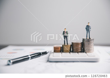 Financial calculate accountant blur background close up on calculator with graph chart banner bank office desk. Finance Concept tax banking money expense accounting budget businessman use calculator. 128728463