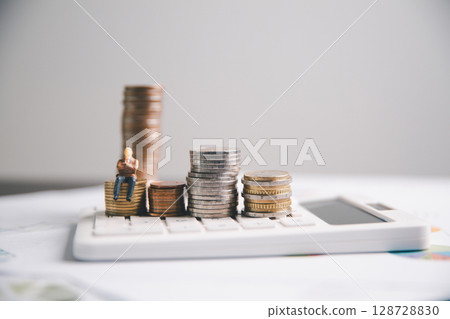 Financial calculate accountant blur background close up on calculator with graph chart banner bank office desk. Finance Concept tax banking money expense accounting budget businessman use calculator. 128728830