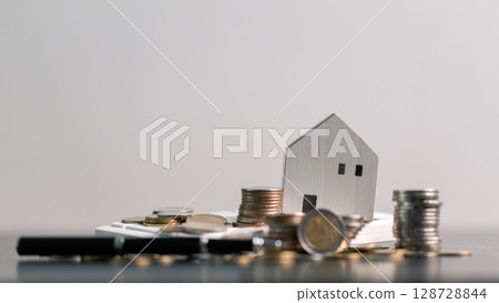 Business home concept involves strategic financial management money coin save bank real estate economic loan investment development growth encourage accountancy buy income stack investment economy 128728844