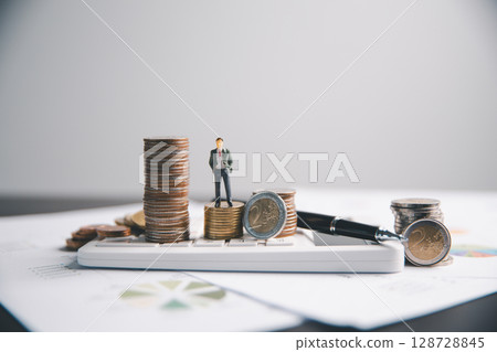 Financial calculate accountant blur background close up on calculator with graph chart banner bank office desk. Finance Concept tax banking money expense accounting budget businessman use calculator. 128728845