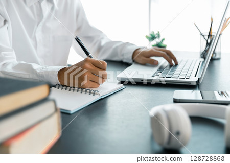 Education concept, learning and teaching with technology, e learning, teaching skills, digital online knowledge, cyberspace global, blur background banner white. hand playing laptop on desk indoor. Education concept, learning and teaching with technology, e learning, teaching skills, digital online knowledge, cyberspace global, blur background banner white. hand playing laptop on desk indoor. 128728868