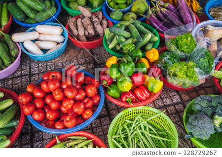 assortment of fresh vegetables at street grocery farmers market in Vietnam in Asia assortment of fresh vegetables at street grocery farmers market in Vietnam in Asia 128729267