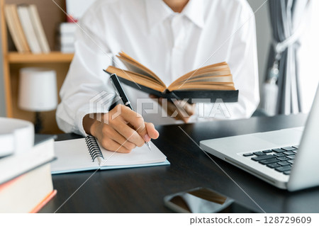 Education concept, learning and teaching with technology, e learning, teaching skills, digital online knowledge, cyberspace global, blur background banner white. hand playing laptop on desk indoor. Education concept, learning and teaching with technology, e learning, teaching skills, digital online knowledge, cyberspace global, blur background banner white. hand playing laptop on desk indoor. 128729609