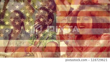 Leaning bearded man wearing shirt, wristbands behind barrier at outdoor show, American flag overlay Leaning bearded man wearing shirt, wristbands behind barrier at outdoor show, American flag overlay 128729621