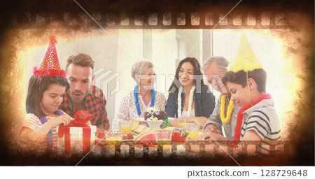 Gathering multigenerational family members celebrating birthday in dining room, with cake and gifts Gathering multigenerational family members celebrating birthday in dining room, with cake and gifts 128729648