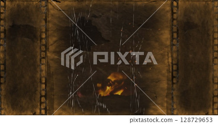 Glowing metallic skull emerging on film reel surface, with sprocket holes, scratches, torn textures Glowing metallic skull emerging on film reel surface, with sprocket holes, scratches, torn textures 128729653