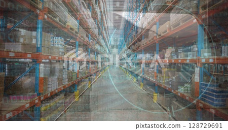Showing empty central aisle stretching inside warehouse, with storage racks and cardboard boxes 128729691