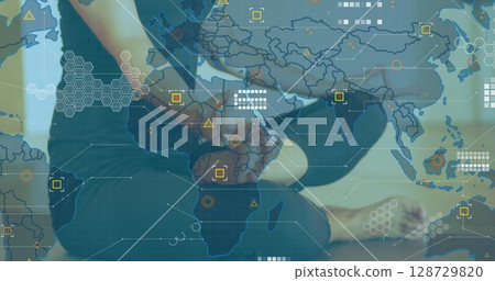 Yoga practitioner performing seated forward fold in yoga studio, with data map overlay, copy space Yoga practitioner performing seated forward fold in yoga studio, with data map overlay, copy space 128729820