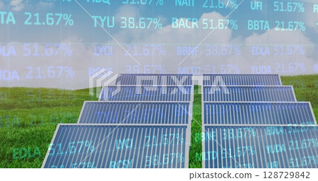 Showcasing solar panel array generating power on green field at rural solar farm, with data overlay 128729842
