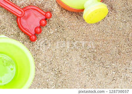 colorful plastic toys for the beach on sand 128730037