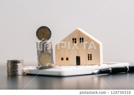 Business home concept involves strategic financial management money coin save bank real estate economic loan investment development growth encourage accountancy buy income stack investment economy 128730310
