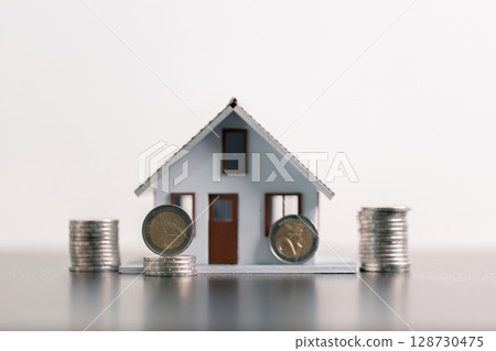 Business home concept involves strategic financial management money coin save bank real estate economic loan investment development growth encourage accountancy buy income stack investment economy 128730475