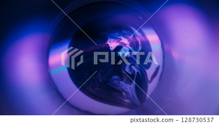 Neon paint spill. Round light. Defocused purple pink green color droplets rainbow texture floating on abstract fluorescent art background. Neon paint spill. Round light. Defocused purple pink green color droplets rainbow texture floating on abstract fluorescent art background. 128730537