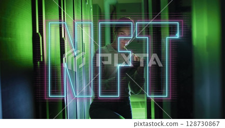 Image of nft text over caucasian woman using tablet in server room 128730867