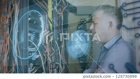 Image of data processing over caucasian man checking servers Image of data processing over caucasian man checking servers 128730899