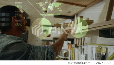 Image of data processing over caucasian male carpenter working in workshop Image of data processing over caucasian male carpenter working in workshop 128730998