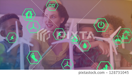 Image of eco icons over happy caucasian female teacher and class of diverse pupils Image of eco icons over happy caucasian female teacher and class of diverse pupils 128731045