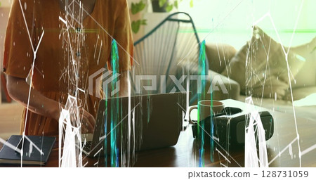 Image of shapes over midsection of caucasian woman using laptop and tablet Image of shapes over midsection of caucasian woman using laptop and tablet 128731059