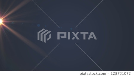 Digital image of orange spot of light against grey background Digital image of orange spot of light against grey background 128731072