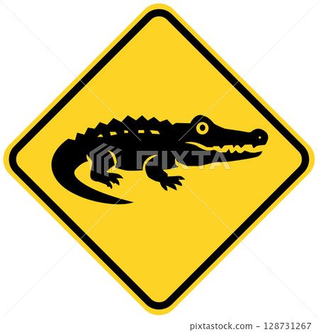 Crocodile on a road sign. Beware alligator road symbol. Crocodile road board. Yellow road sign Crocodile. Crocodile on a road sign. Beware alligator road symbol. Crocodile road board. Yellow road sign Crocodile. 128731267