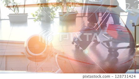 Composite image of plane against mid section of people walking at airport Composite image of plane against mid section of people walking at airport 128731424
