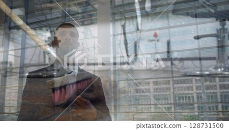 Image of data processing over geometrical shapes and caucasian man walking 128731500