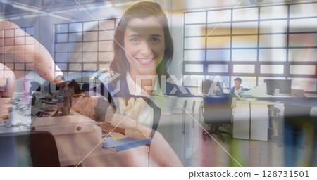 Image of hands of caucasian man with smartwatch over happy businesswoman 128731501
