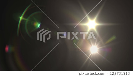 Image of glowing lights and spots over black background 128731513