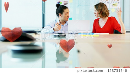 Image of hearts falling over diverse coworkers talking in office Image of hearts falling over diverse coworkers talking in office 128731546