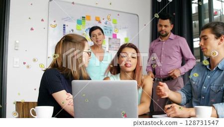 Image of purple lights trails over business people in office Image of purple lights trails over business people in office 128731547