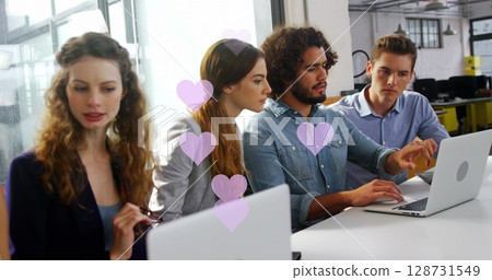 Image of falling hearts over diverse group of business people 128731549