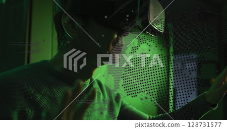 Image of data processing and globe over asian male it technician wearing vr headset Image of data processing and globe over asian male it technician wearing vr headset 128731577