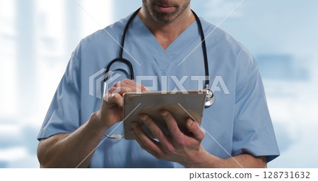 Image of caucasian male doctor using tablet over hospital 128731632