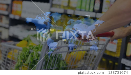 Image of world map over midsection of man with shopping cart Image of world map over midsection of man with shopping cart 128731674