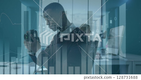 Image of financial data processing over basketball player 128731688