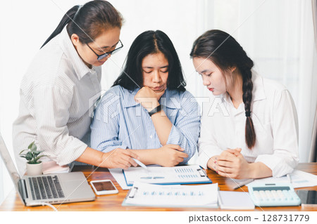 Teamwork with business people analysis cost graph on desk at meeting room. partnership analysis graph company financial budget report, cost work progress planning, business team analysis graph data Teamwork with business people analysis cost graph on desk at meeting room. partnership analysis graph company financial budget report, cost work progress planning, business team analysis graph data 128731779